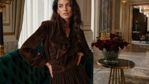 London fashion editor wearing chocolate brown suede jacket and coloured tights in early August, previewing A/W 26 trends