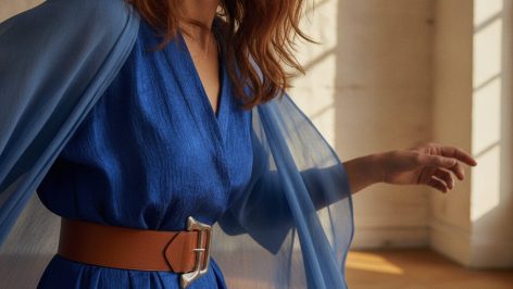 Why ‘over flip flops and’ is suddenly the UK’s most-searched styling formula Leather thong flip-flops styled with wide-leg tailored trousers and a trench coat on a UK street