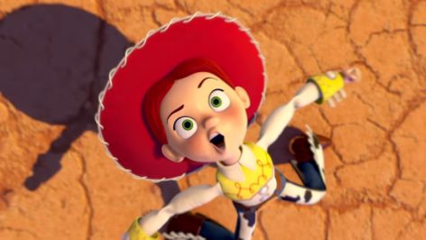 Jessie the Cowgirl character singing in the desert in the official Toy Story 5 music video by Taylor Swift.